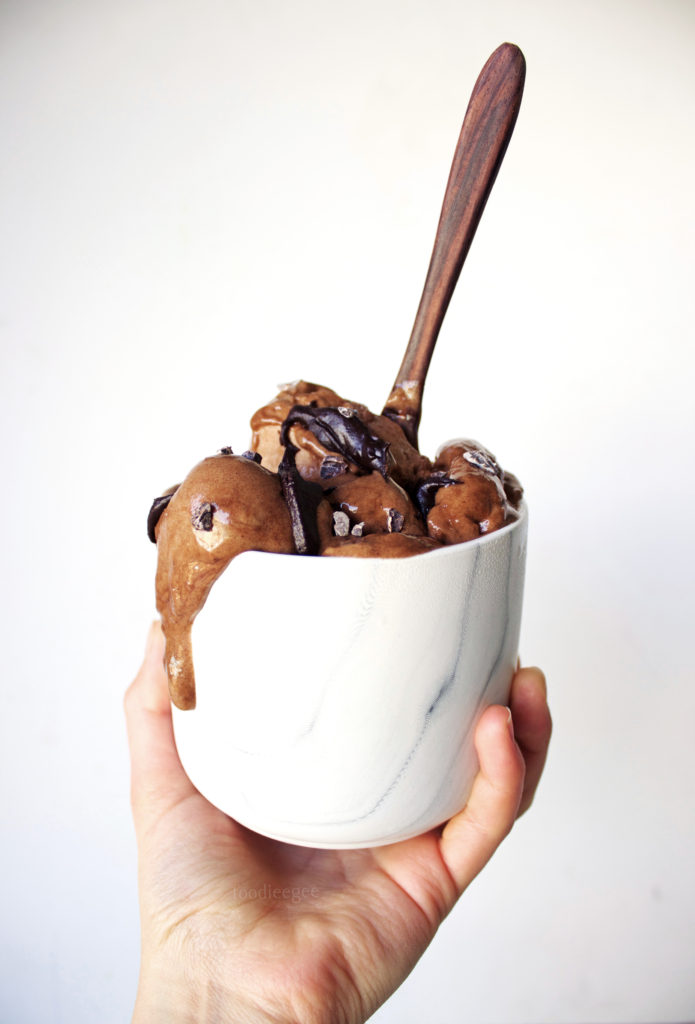 thick, rich, chocolate nice-cream in a bowl with a coconut bowl wooden spoon. The best, healthy, non-dairy alternative to ice-cream.