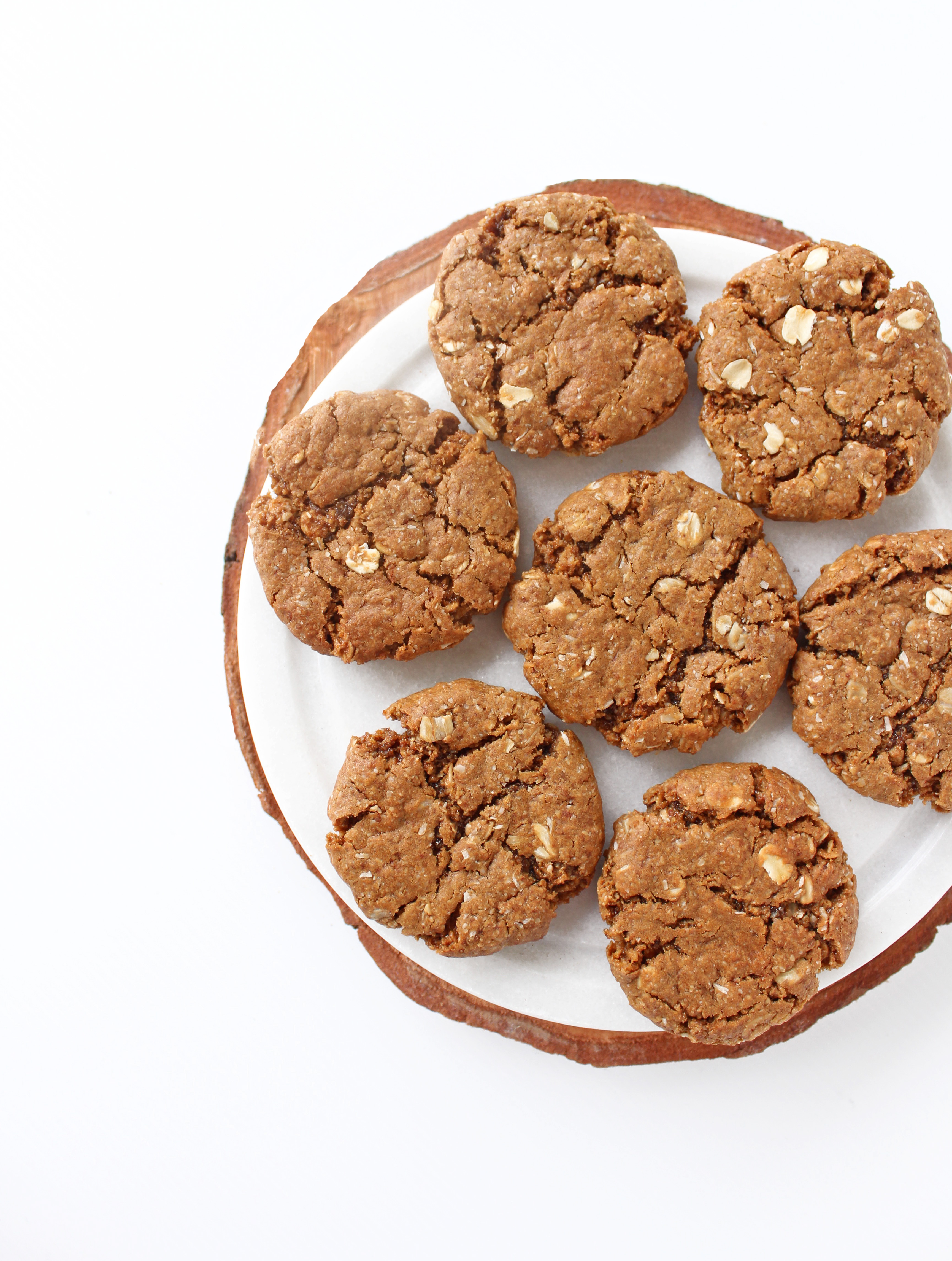 A plateful of golden, chewy Vegan Anzac biscuits. Healthy, plantbased, gluten free sugar free anzac cookies