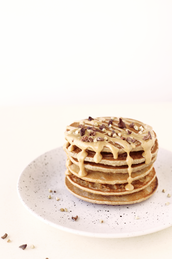  A healthy vegan pancake stack drizzled with peanut butter, made from buckwheat flour and gluten free, oil free, refined sugar free ingredients. Quick, simple, easy and made in under 15 minutes!