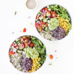 Healthy mexican vegan burrito bowls with black beans, guacamole, salsa, salad - gluten free, plantbased, soy free, oil free, dairy free, meatless / meat free, sugar free homemade salad
