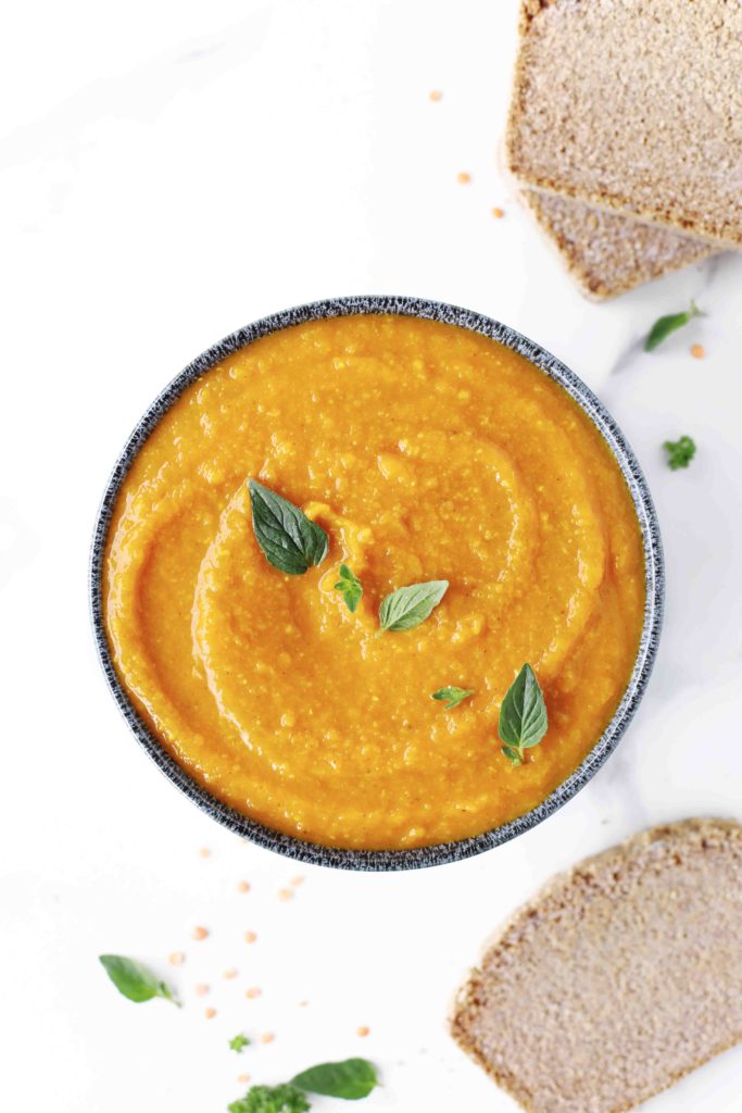 hearty pumpkin and red lentil soup with homemade wholegrain bread on the side- vegan, gluten free, oil free, high protein