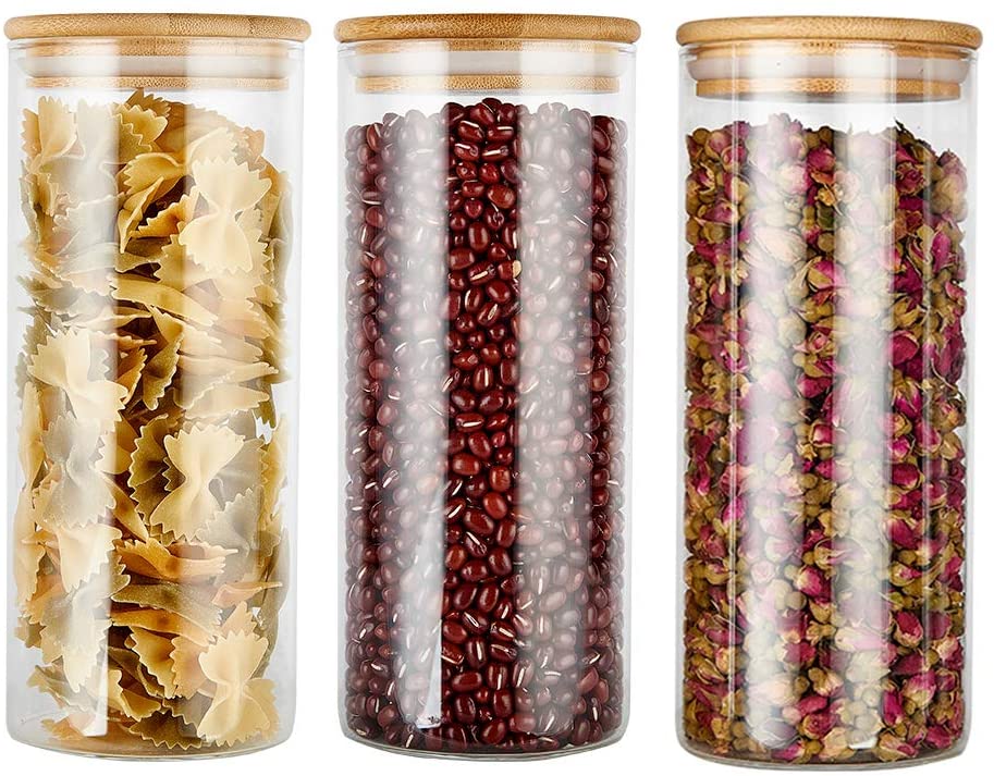 Aesthetic Glass pantry food storage jars/ containers with bamboo lids filled with pasta beans and spices