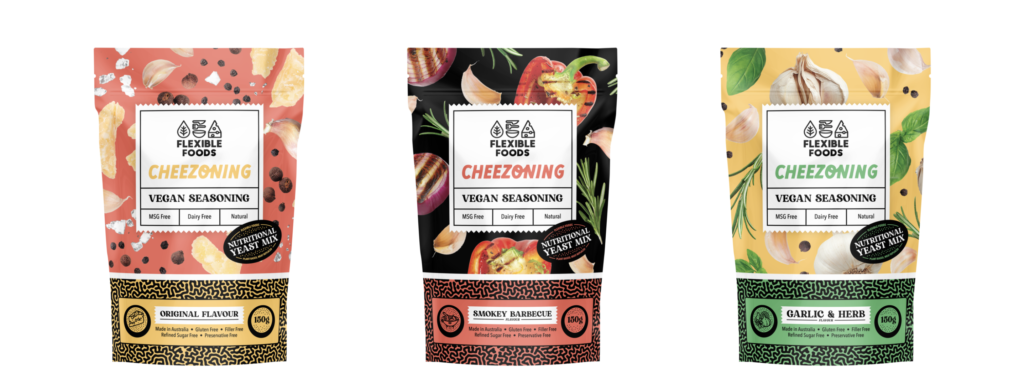 Coloured product packaging of packets of vegan cheese seasoning blends in the flavours Original nutritional yeast, smokey  arabesque and garlic & herb seasoning - Flexi Foods Cheezoning range