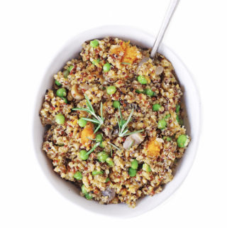 Creamy mushroom risotto with pumpkin, peas and quinoa for one of the best, healthy dinner recipes (without white wine). An easy plant based meal with vegetables topped with nutritional yeast dairy free parmesan